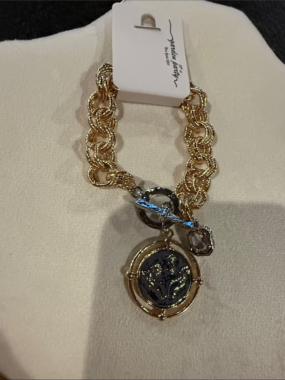 Gold-Tone Chain Bracelet with Black Medallion Charm